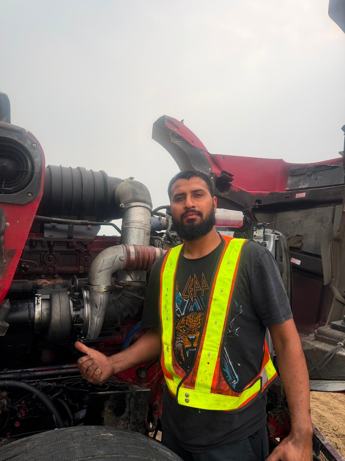 Mechanic checking a heavy truck engine