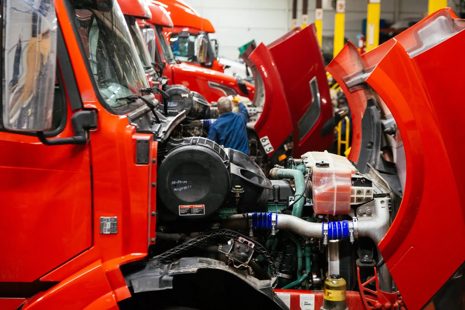 Mechanic checking a truck wheel during inspection