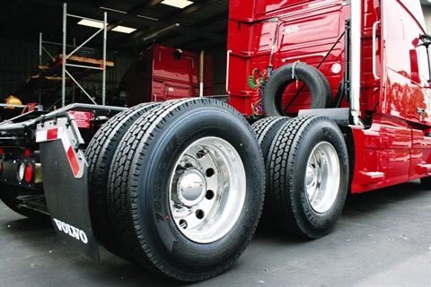Mechanic replacing a truck tire