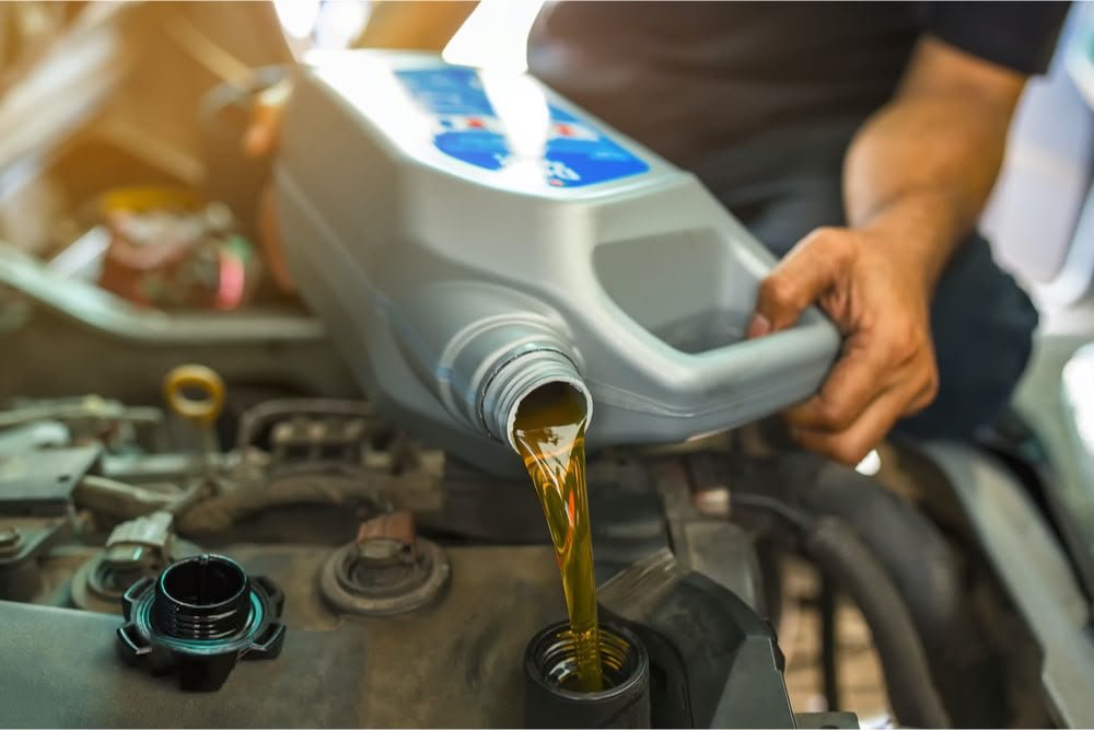 Mechanic performing an oil change